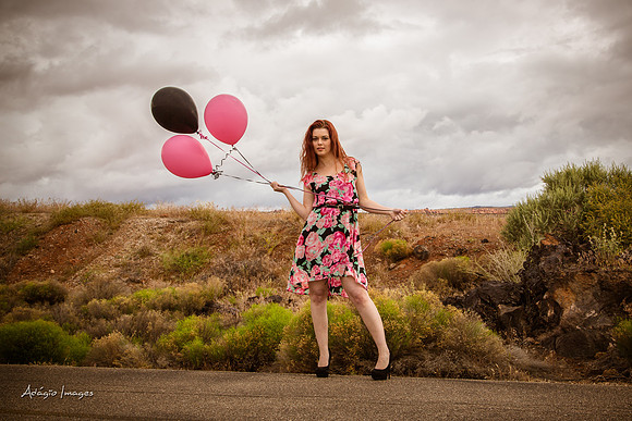 A girl and her balloons