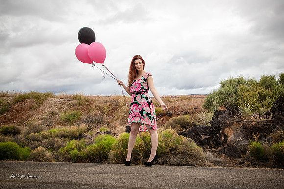 A girl and her balloons